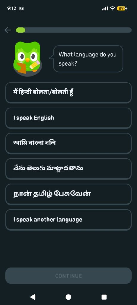 An onboarding menu page in the Duolingo application featuring a green owl character asking the user what language they speak with button selections available in Hindi, English, Bengali, Telugu, and Tamil.